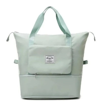 Bolso viajero plegable verde menta con bolsillo frontal y asas